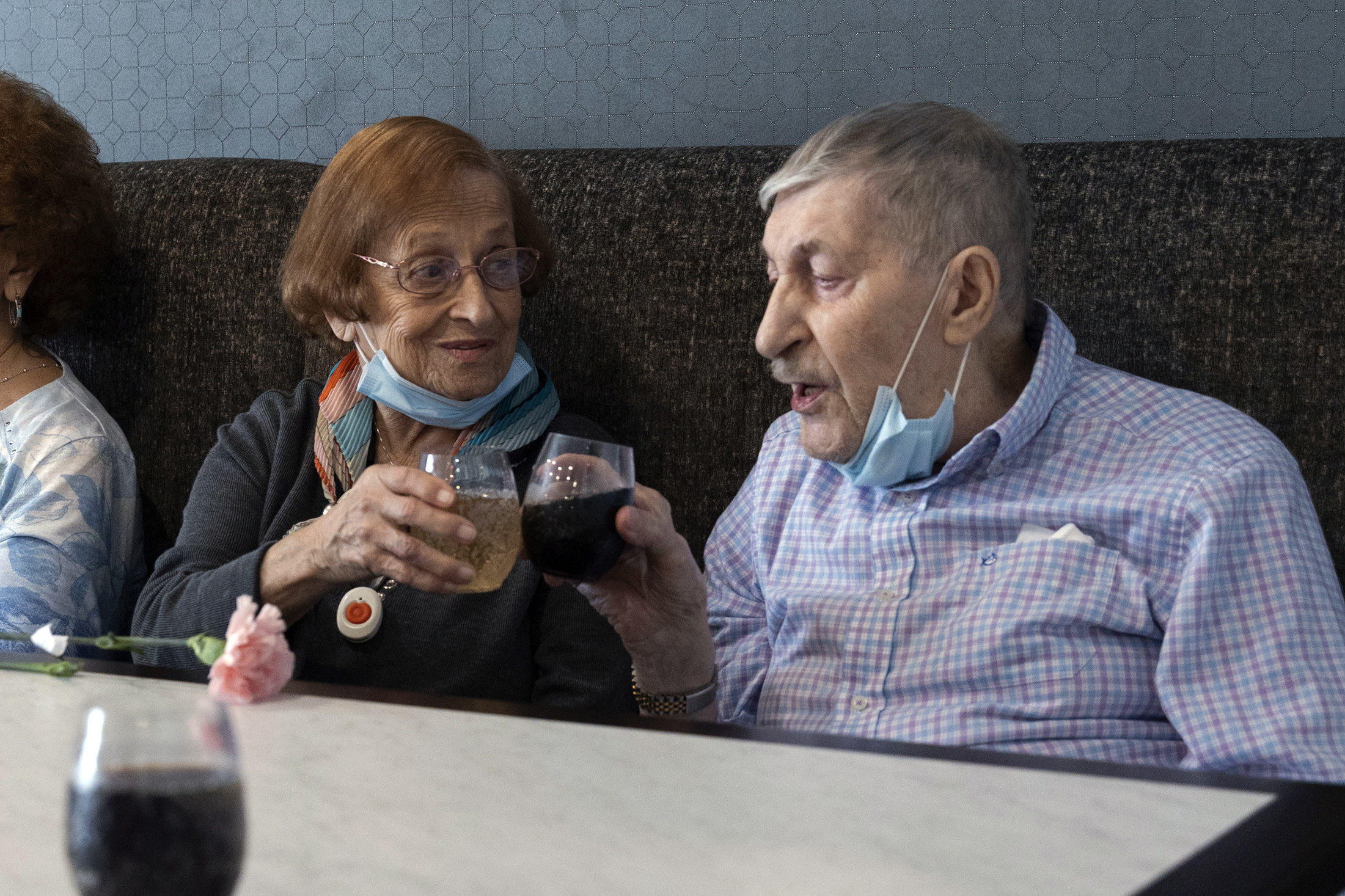 Two people drinking wine at a table