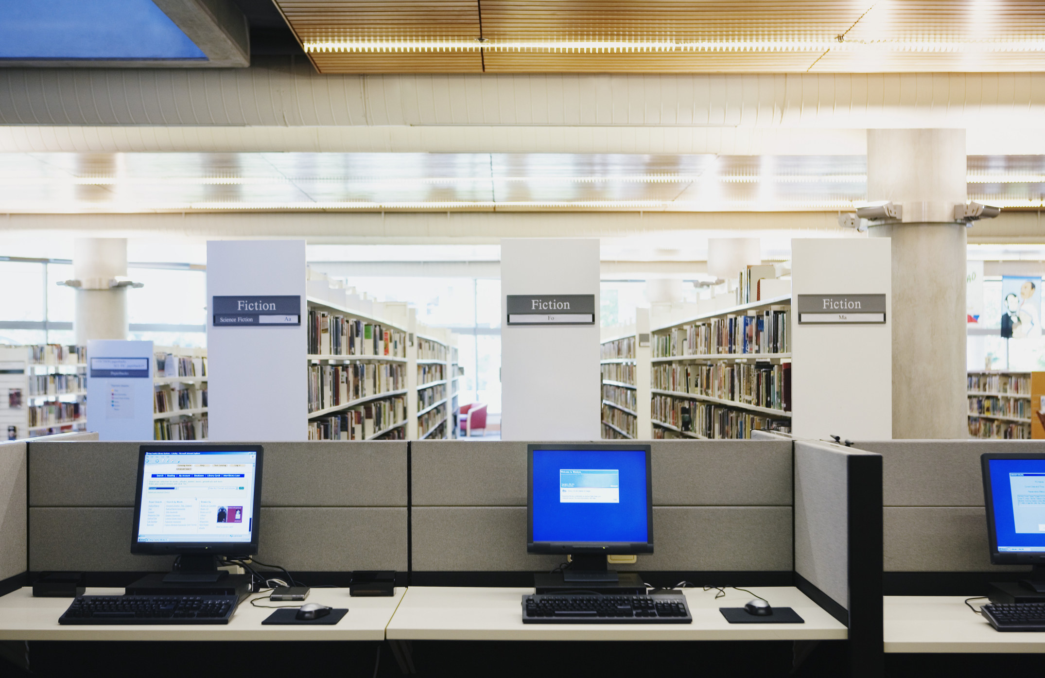A row of computers at a library