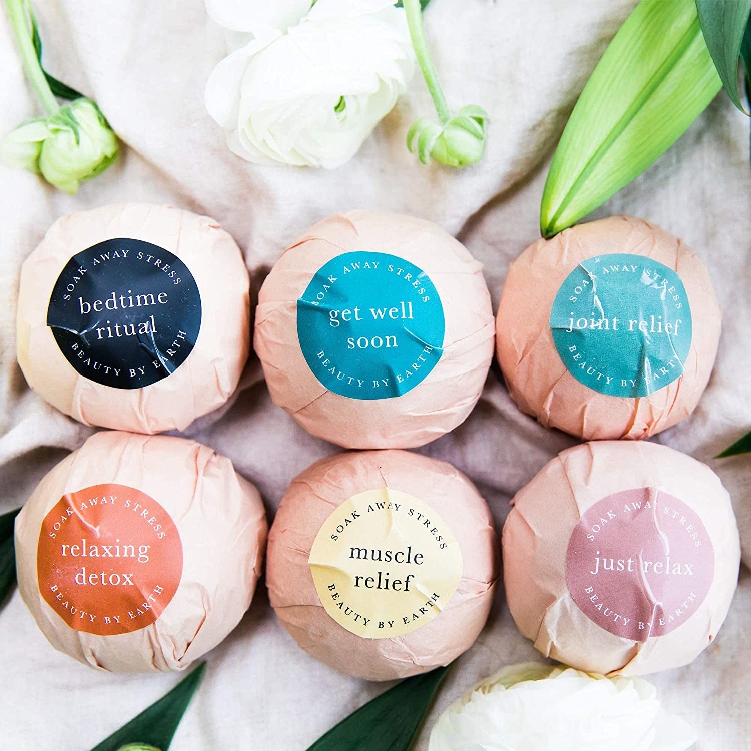 Six bath bombs that are wrapped up in paper