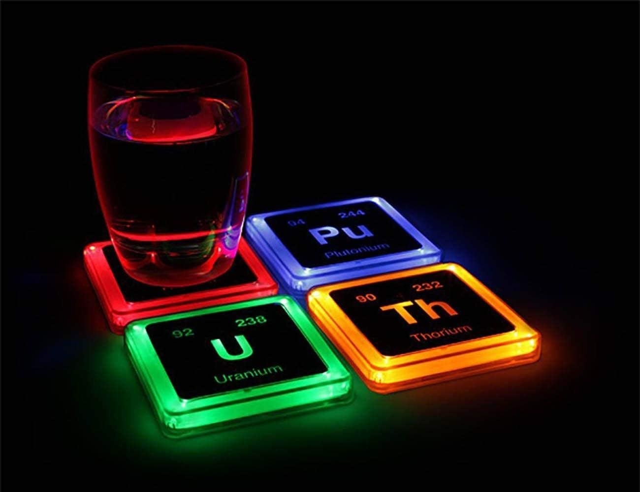 a set of four glowing coasters stylized to look like periodic elements
