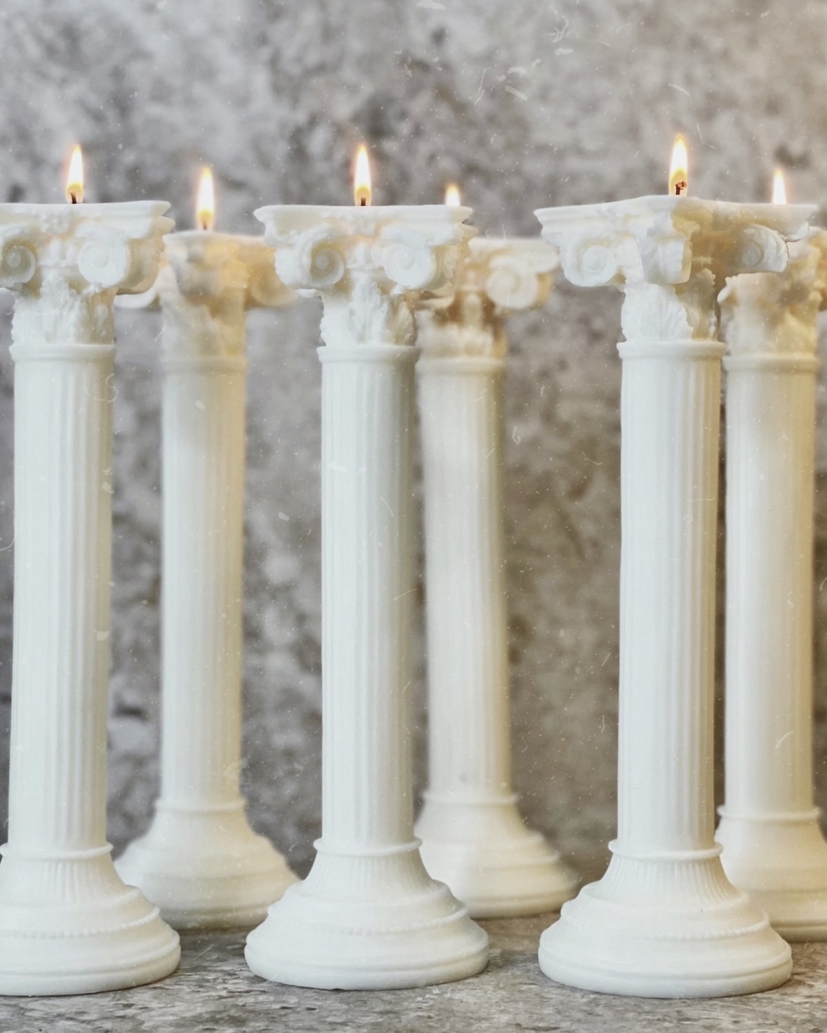 six of the white roman column candles