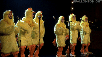 GIF men in chicken costumes dancing