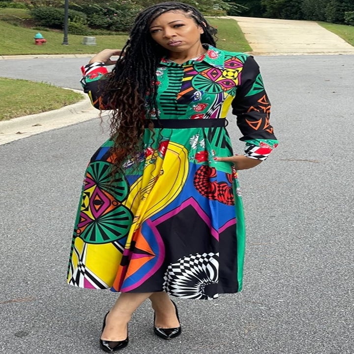 Reviewer wearing the multicolored dress