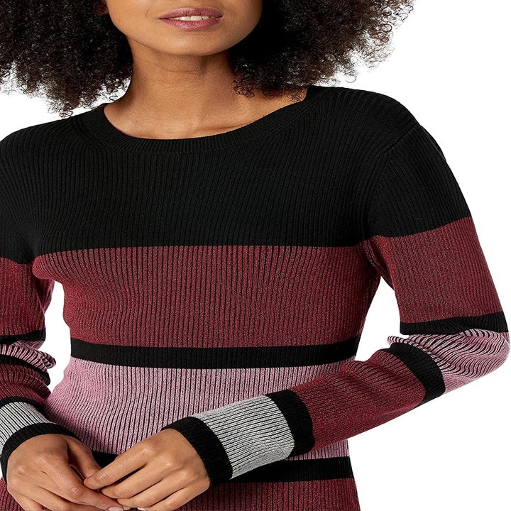 Close-up of a model wearing the striped dress