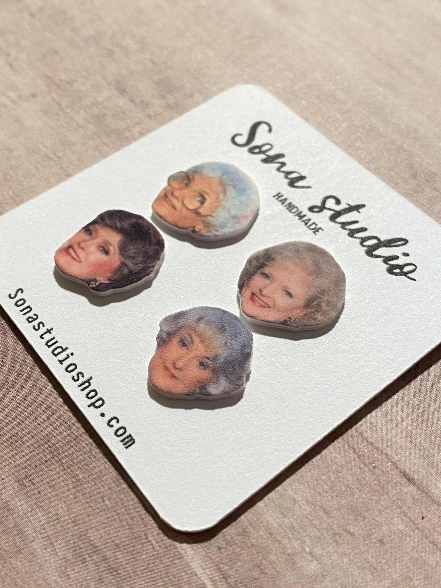 four earrings with all four golden girls on them