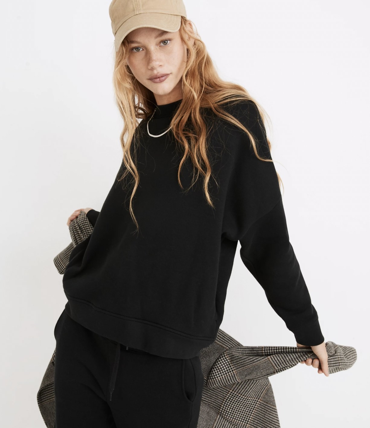 Model wearing the black sweater