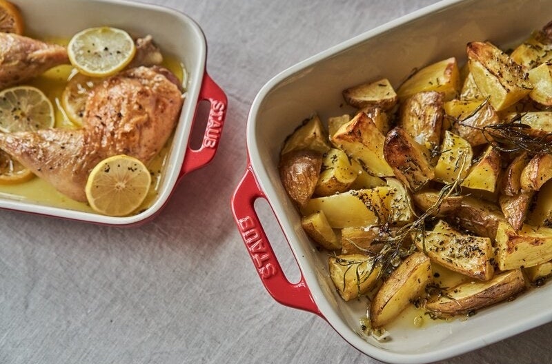 Two baking dishes filled with baked food