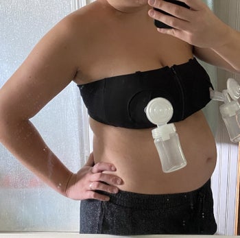 reviewer mirror selfie pumping hands-free with bra, straps down