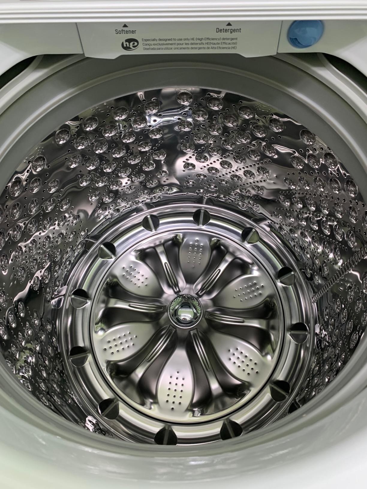 reviewer image of the sparklingly clean inside of a washing machine