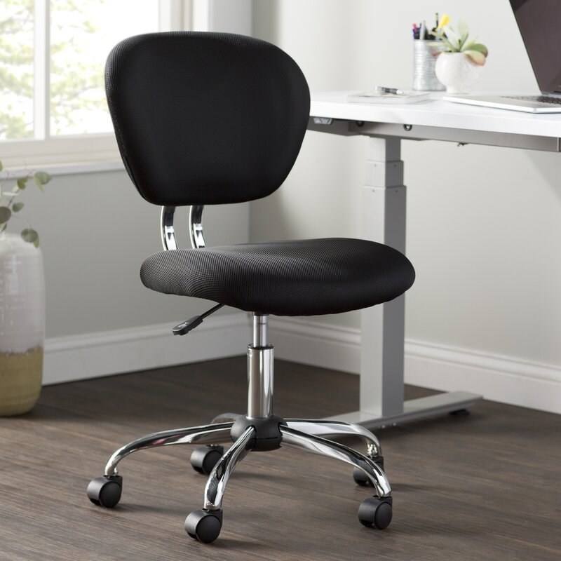 Black task chair next to a desk