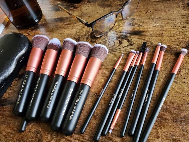 reviewer's black and rose gold makeup brush set