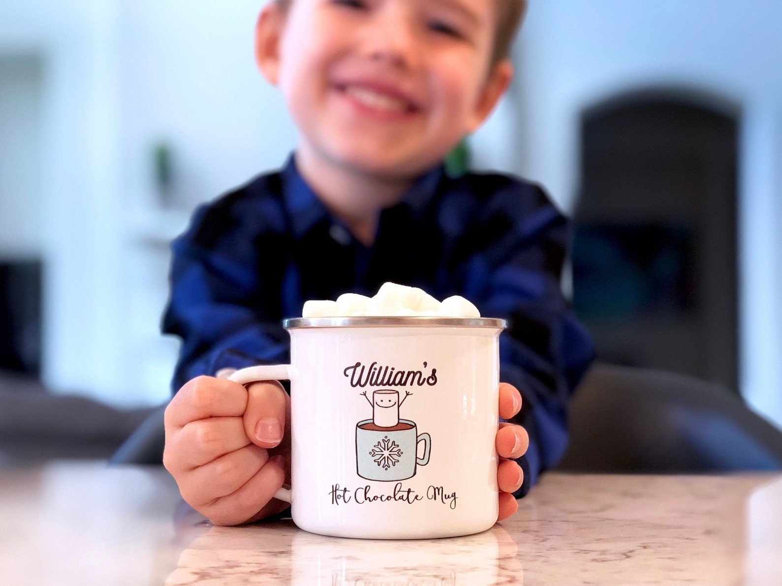 A child holding a personalized mug