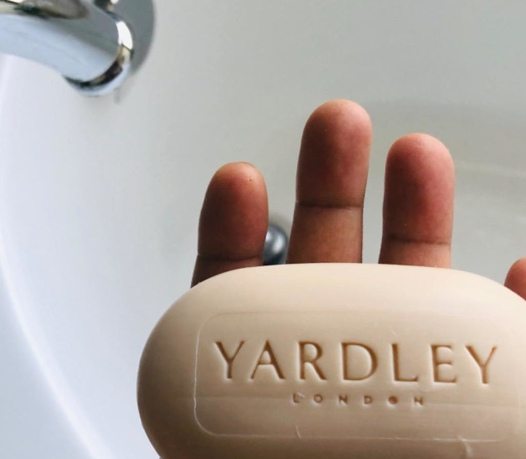 a reviewer photo of a hand holding the bar of soap