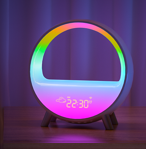 The illuminated clock on a bedside table
