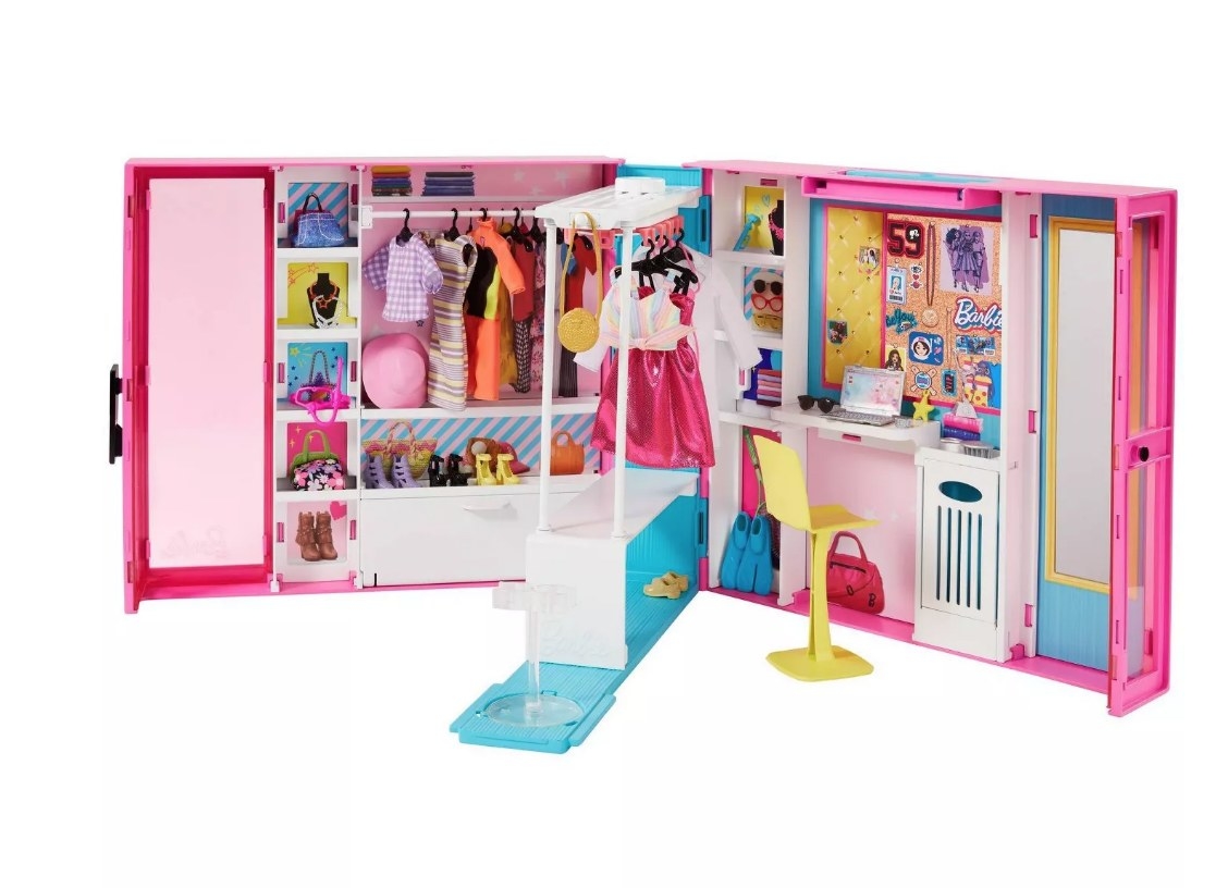 Pink Barbie dream closet with clothes inside, Barbie&#x27;s desk and chair on right