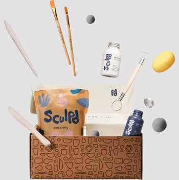 the pottery kit with each included item sprawled into the air