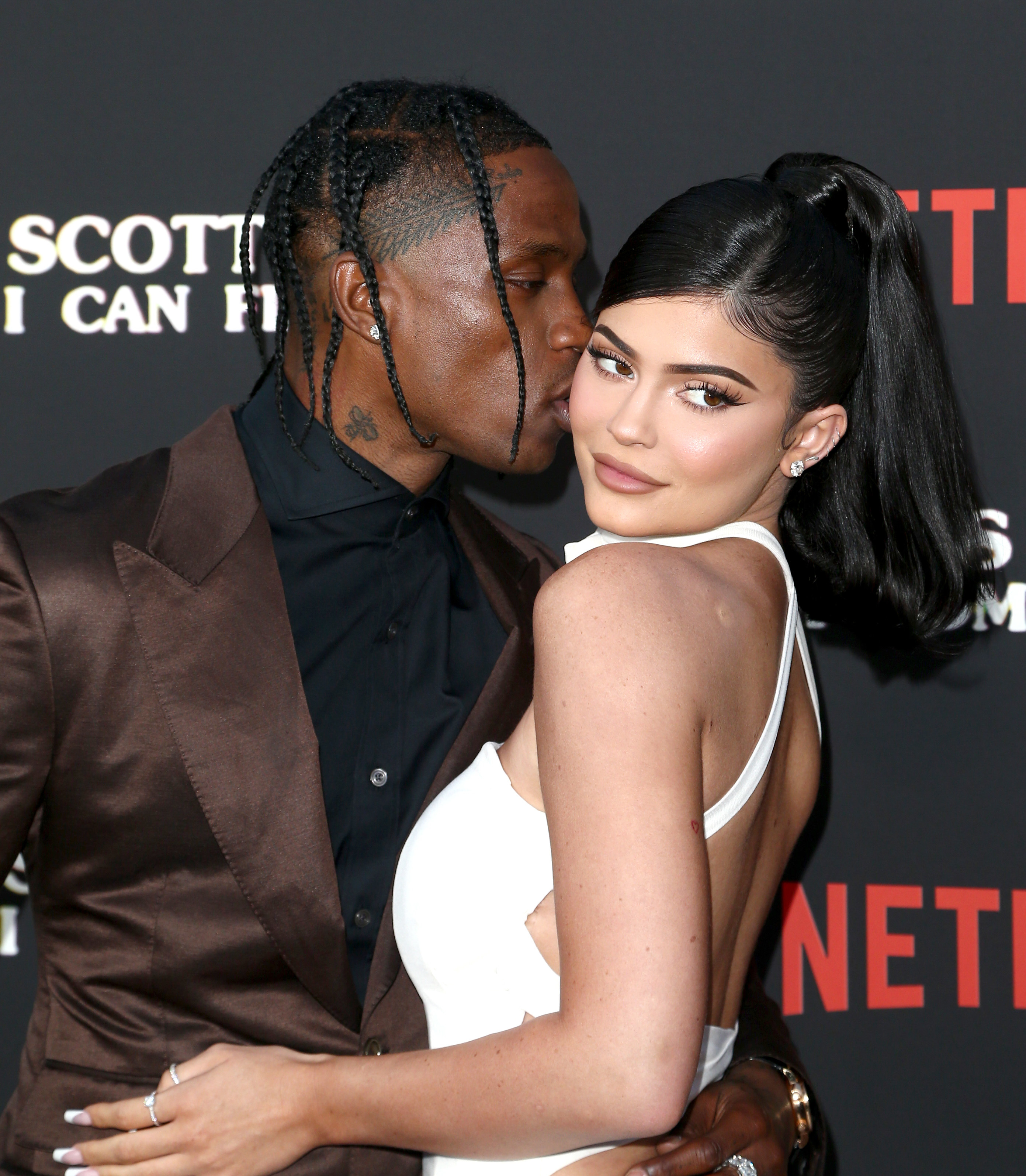 Travis kissing Kylie on the red carpet
