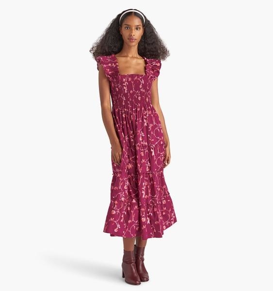 model wearing a burgundy floral nap dress