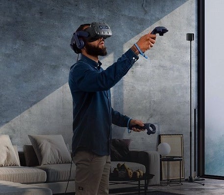 someone using the virtual reality headset in their living room