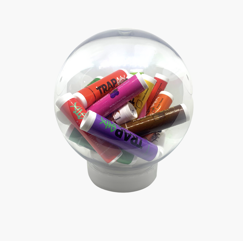 a clear snow globe filled with different lip balm flavors named after music artists