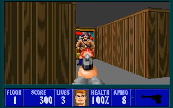 A first person view of a player shooting down a Nazi in Wolfenstein 3D