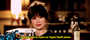Woman holding a glass and saying &quot;I just wanted to listen to Taylor Swift alone&quot;