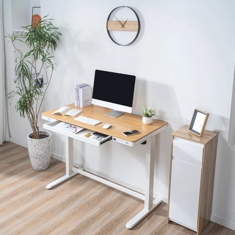 desk with drawer and keyboard for height controls