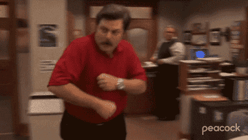 Ron Swanson from Parks and Recreation doing a happy dance