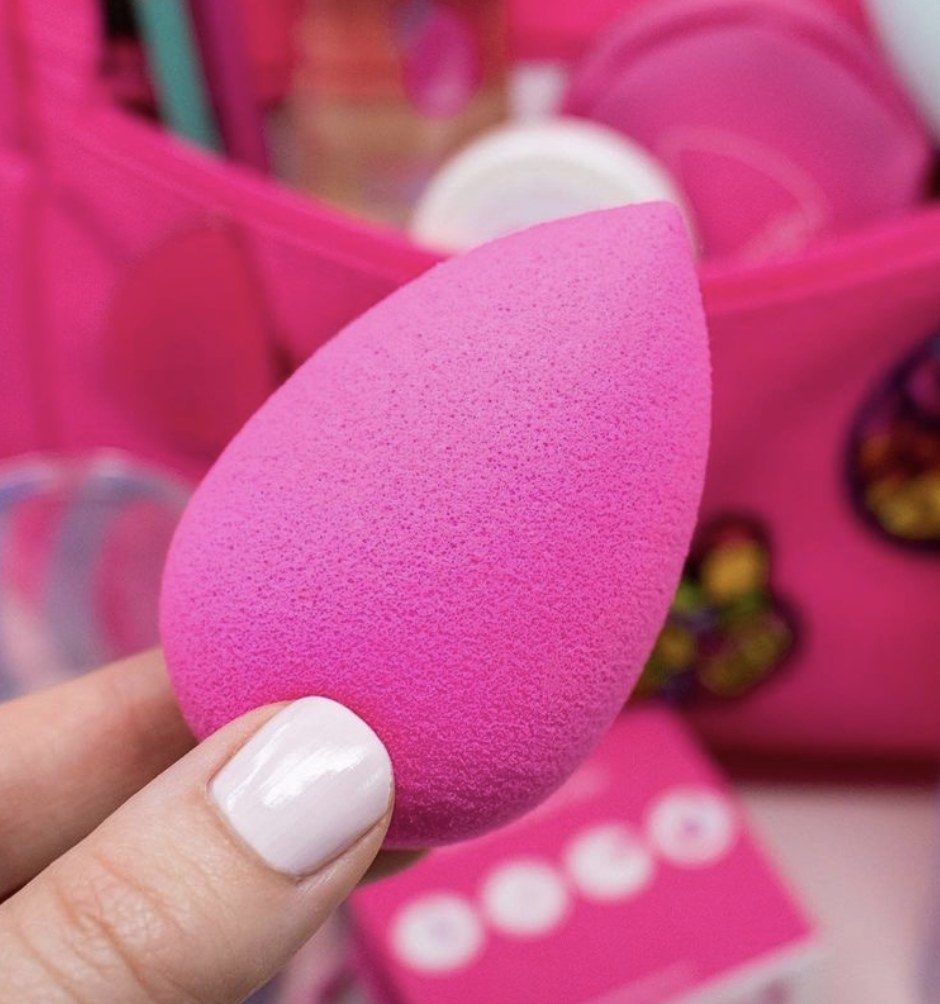person holding the beauty blender