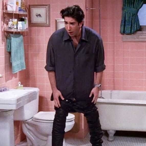 Ross is in the bathroom where he cannot put his leather pants back on