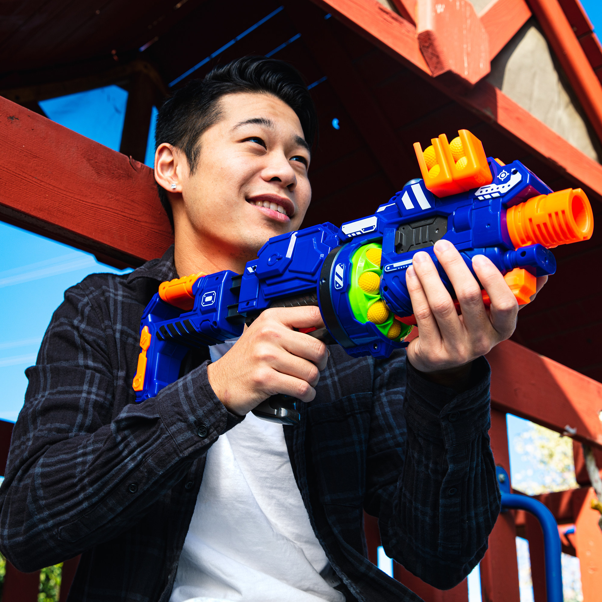 a teenager holding the blaster