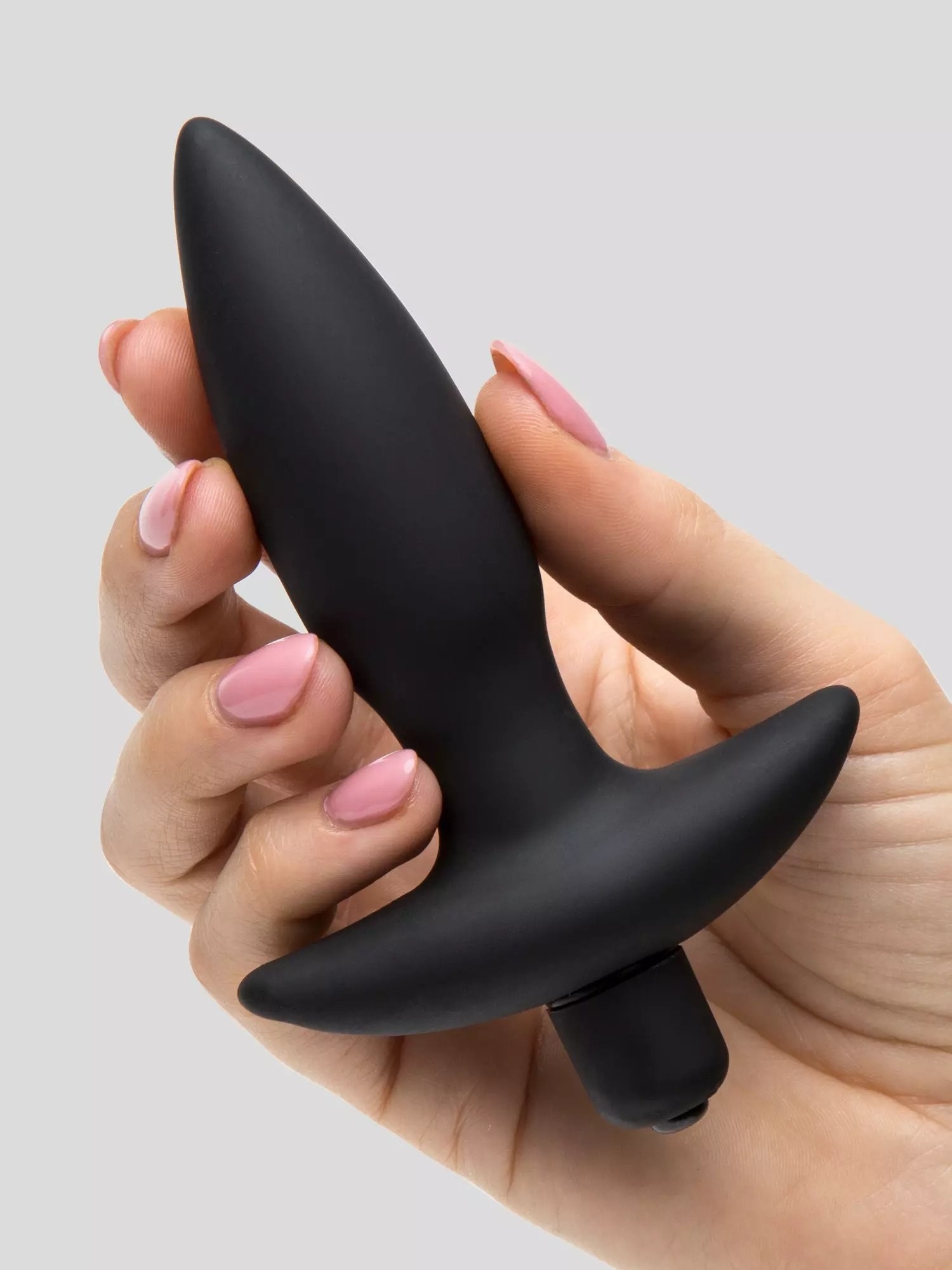 Model holding black anal plug