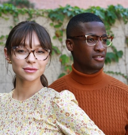 Two models wearing acrylic eye glasses