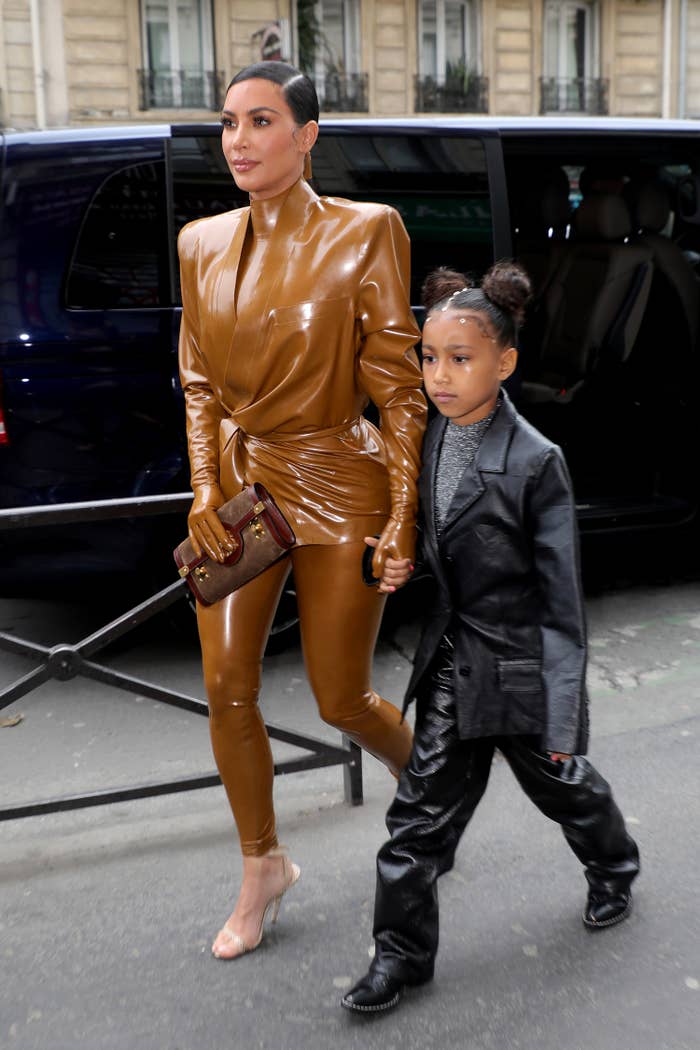 Kim and North walking down a street