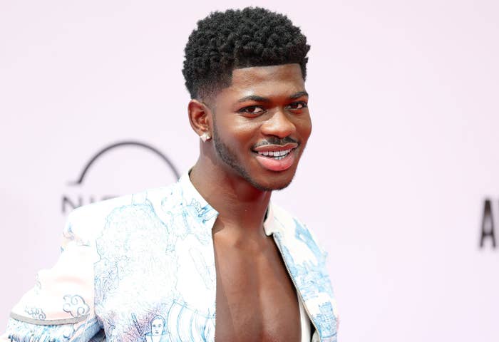 Lil Nas X smiling on the red carpet
