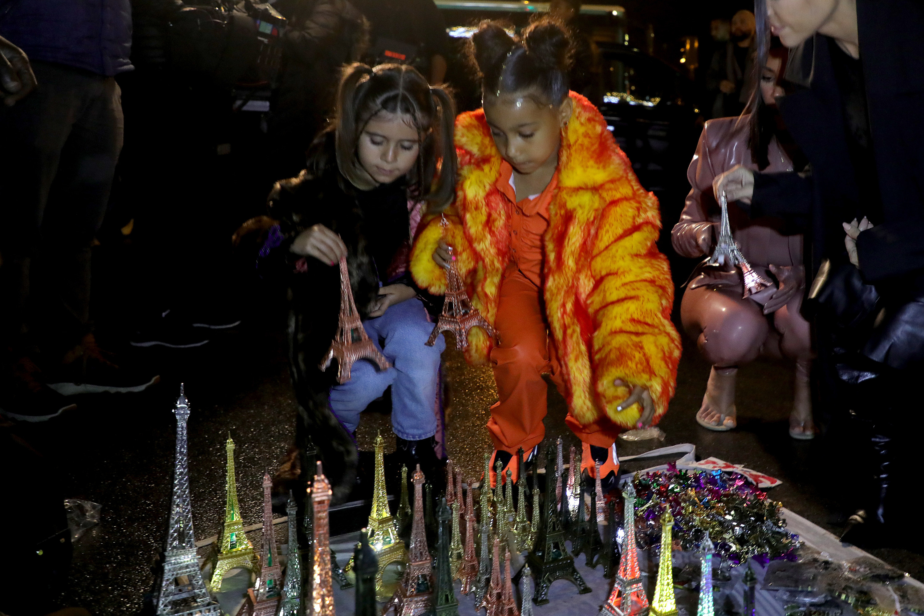 North and Penelope playing with miniature Eiffel Towers