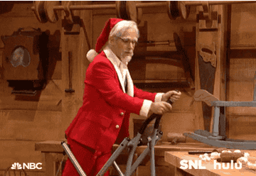 an actor dressed as Santa on an elliptical