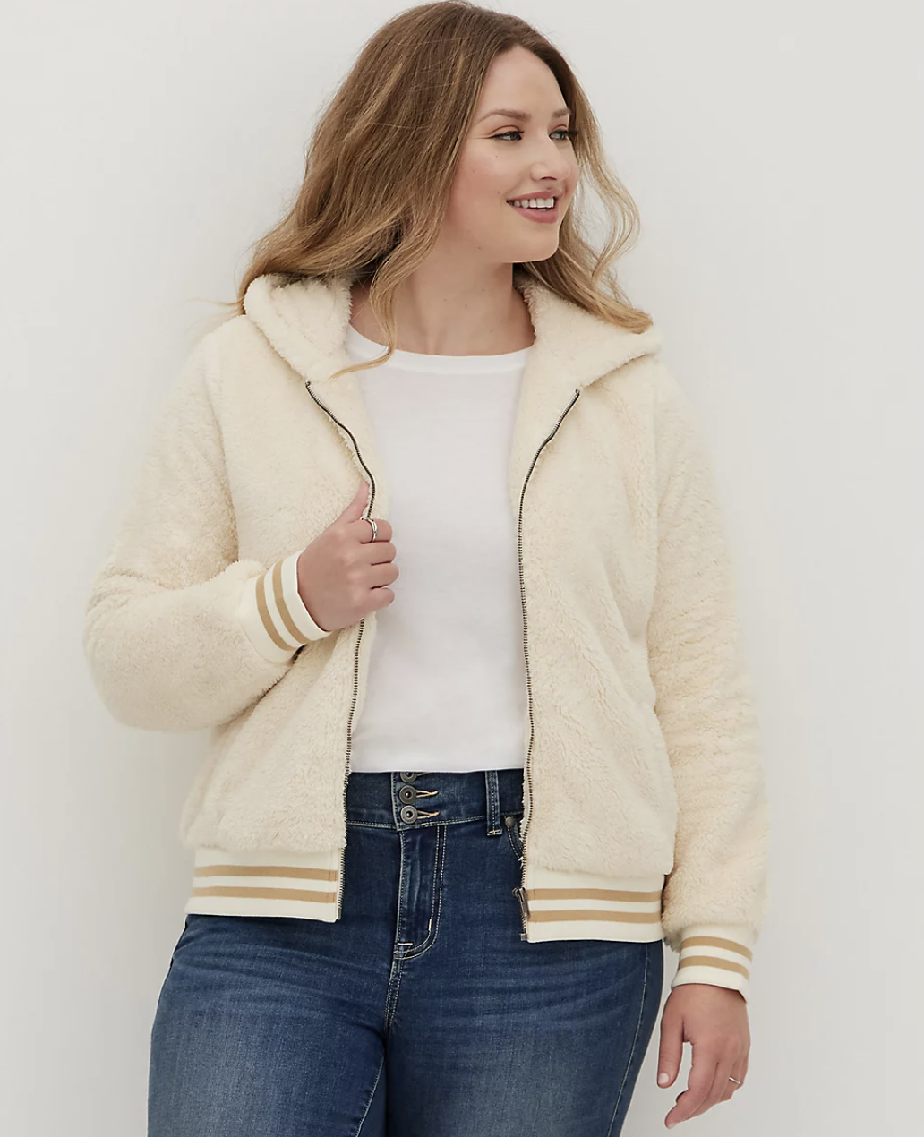 Model in ivory zippered sherpa jacket