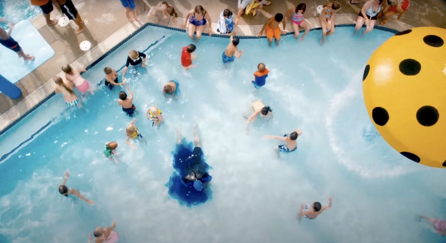Kevin James as Eric is surrounded by blue dye after peeing in the pool at the water park in &quot;Grown Ups&quot;