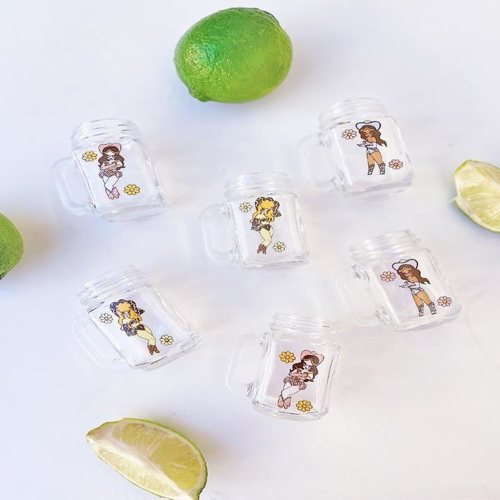 a close-up of each shot glass with a lime beside it