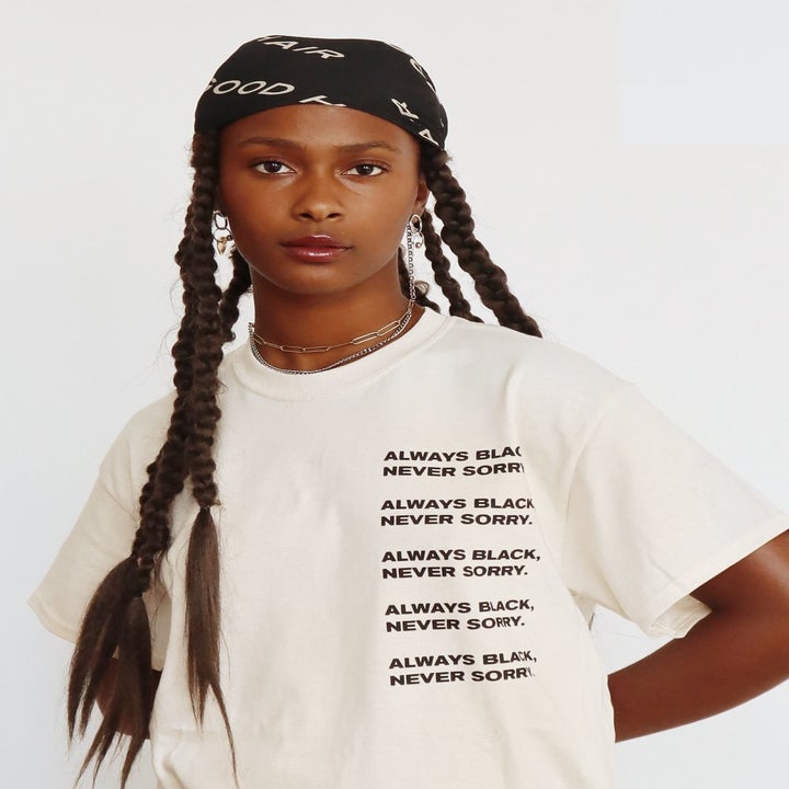 model wearing a t-shirt that says "Always Black never sorry" on it five times