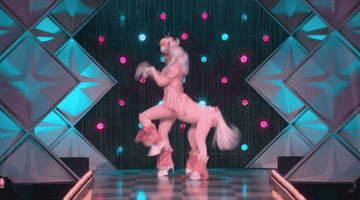 gif of drag queen dressed like a pink centaur