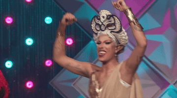 drag queen celebrating on stage after her win