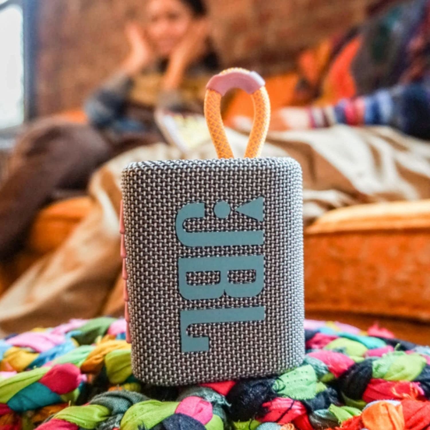 A small speaker on a cushion