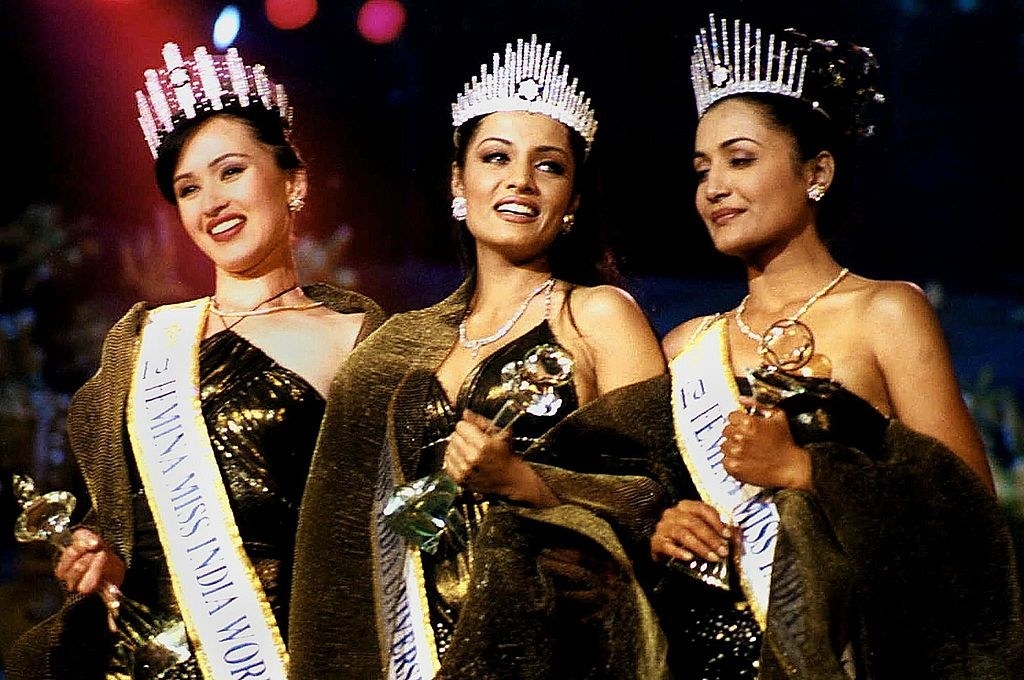 Celina Jaitly, Sara Corner, and Maheshwari Thyagrajan winning their respective crowns and trophies
