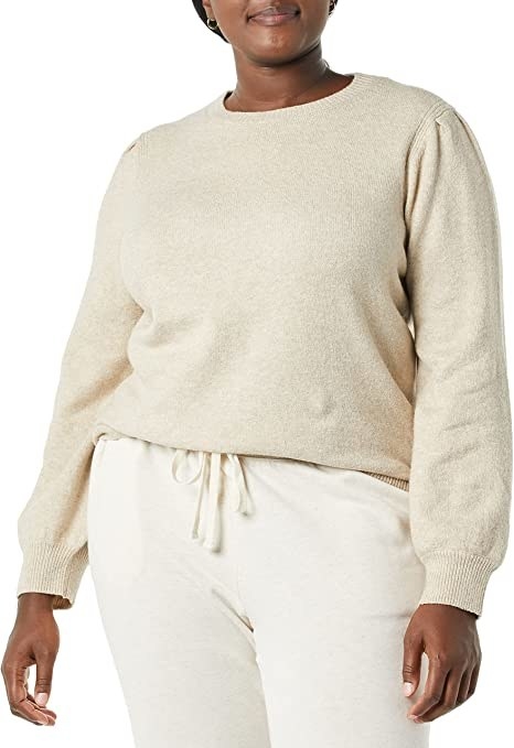 A person wearing a knit sweater