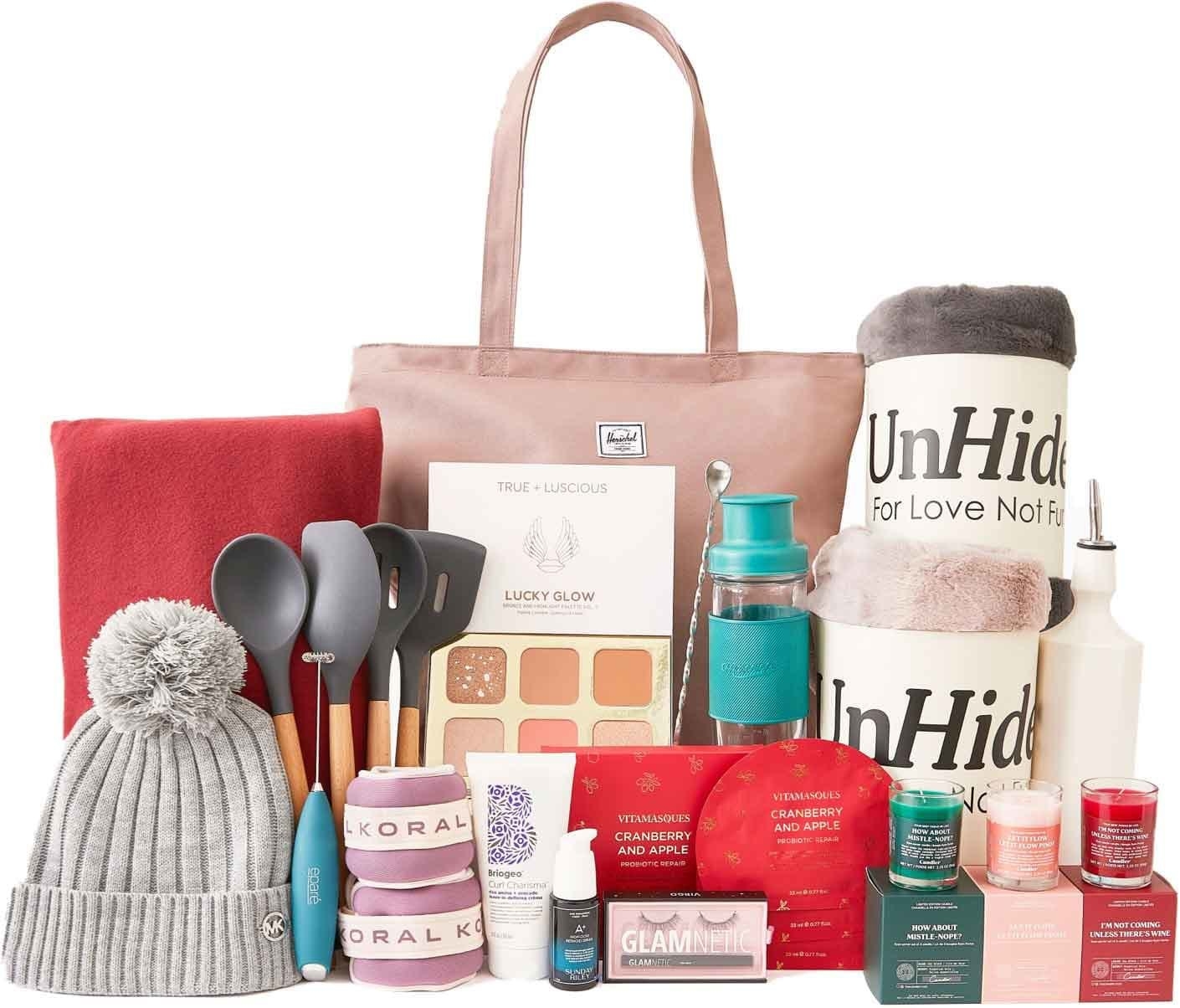 various products including a hat, blankets, candles, beauty products, a tote, makeup, and kitchen utensils