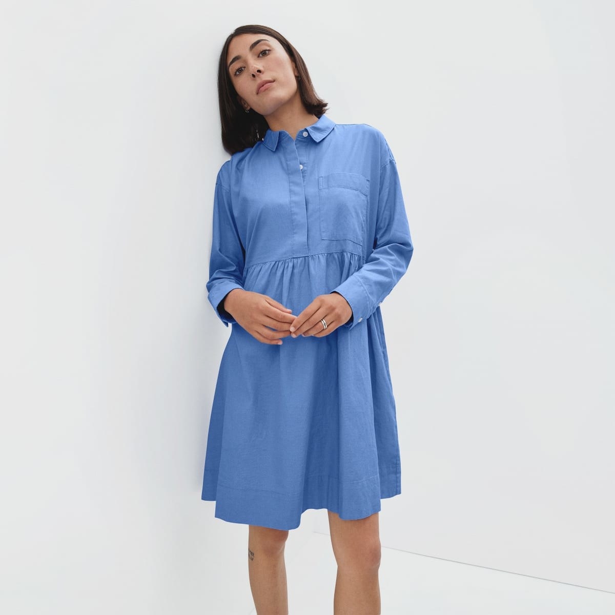 model in blue long-sleeve shirtdress
