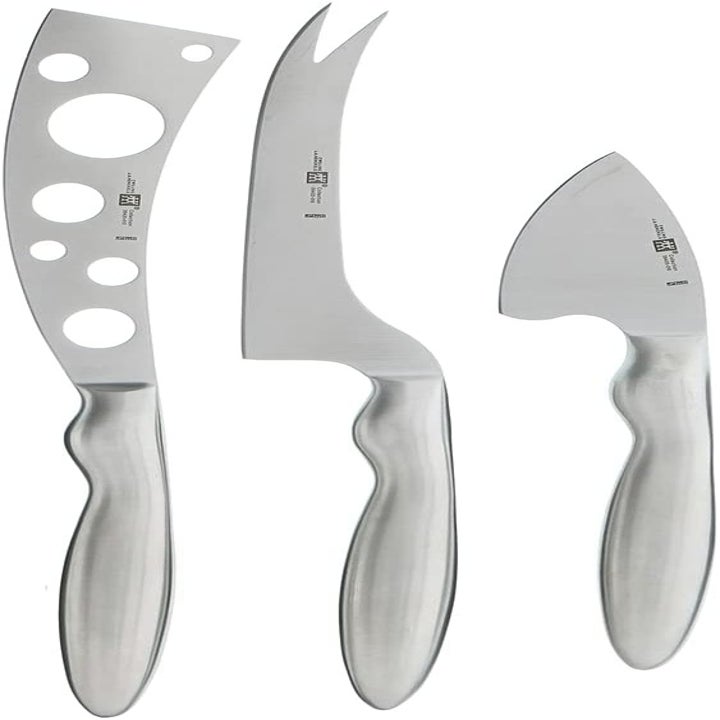 Cheese knives on white background