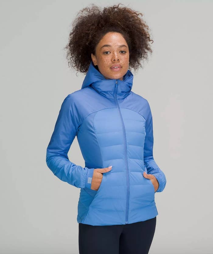 Model wearing blue running jacket